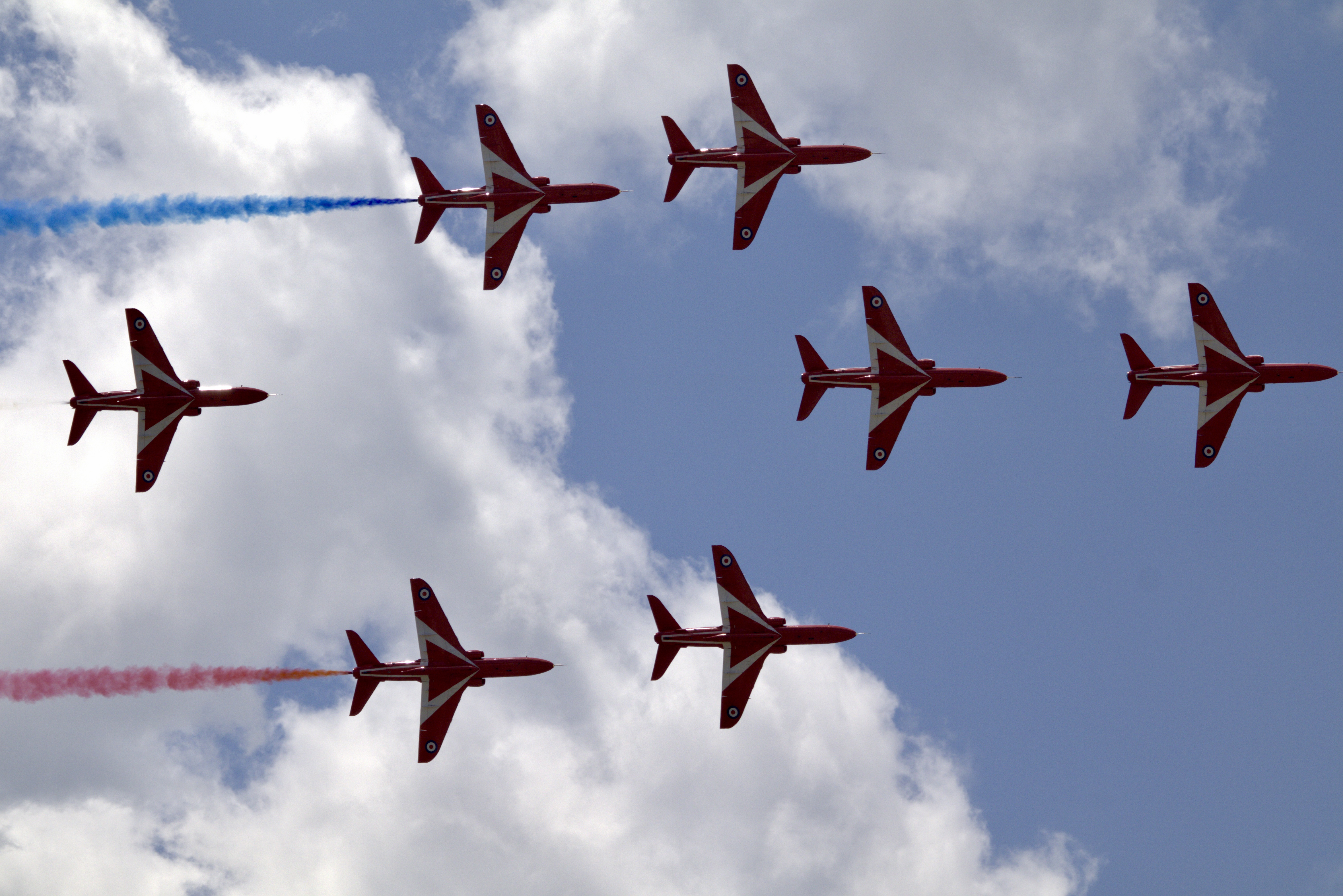 7 RAF Red Arrows with red and blue smoke
